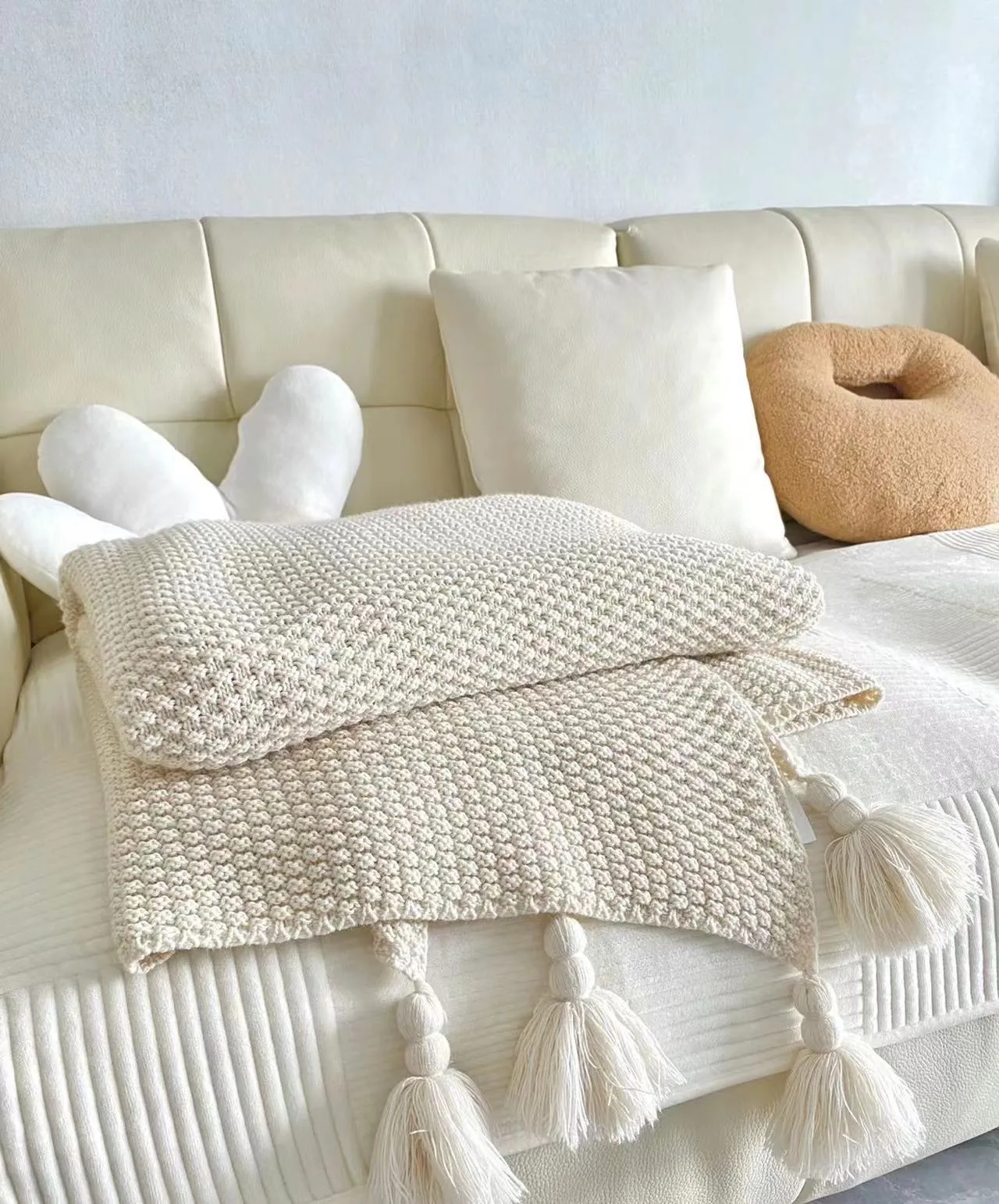 Ivory Tassel Throw - alternate view; styling objects excluded