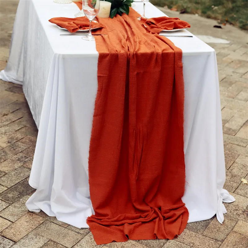 Long terracotta runner draped over a dining table