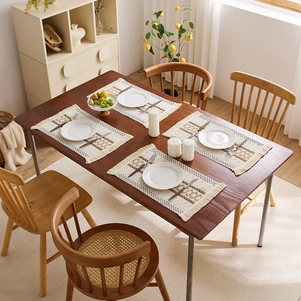 Four placemats used with dinner plates and cutlery; tableware not included
