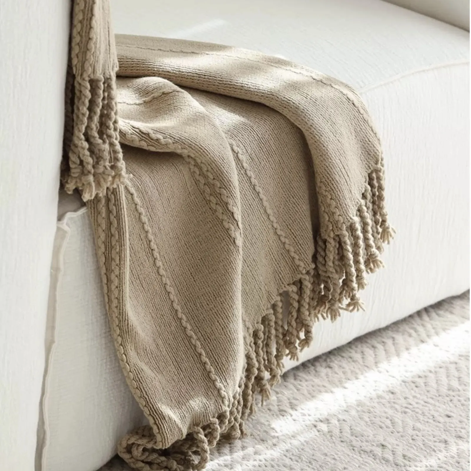 Original supplier close view of the camel knit, cable columns and twisted fringe